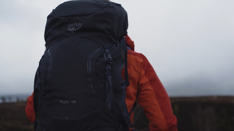 A Person with A Backpack Walking, Ideal for Carrying Easy-To-Pack Games on A Backpacking Trip