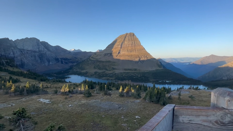 A Panoramic View of A Mountain and Lake in Glacier National Park During Summer