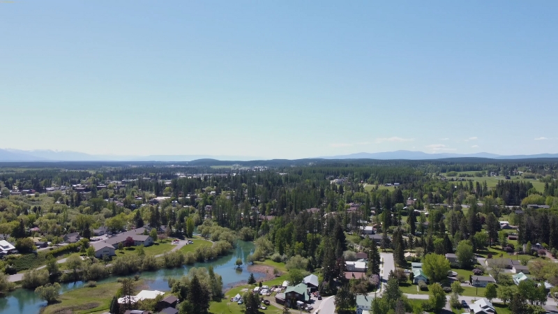 Aerial View of A Scenic Town Surrounded by Greenery, Perfect for A Whitefish to Bozeman Road Trip